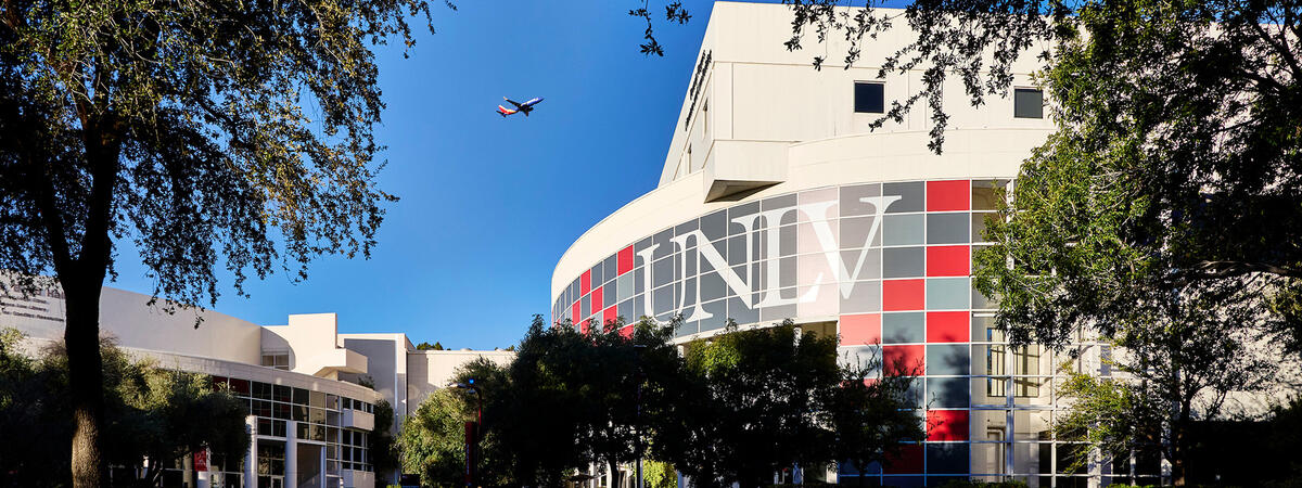Exterior of the Beverly Rogers Literature and Law Building showing the U.N.L.V. letters