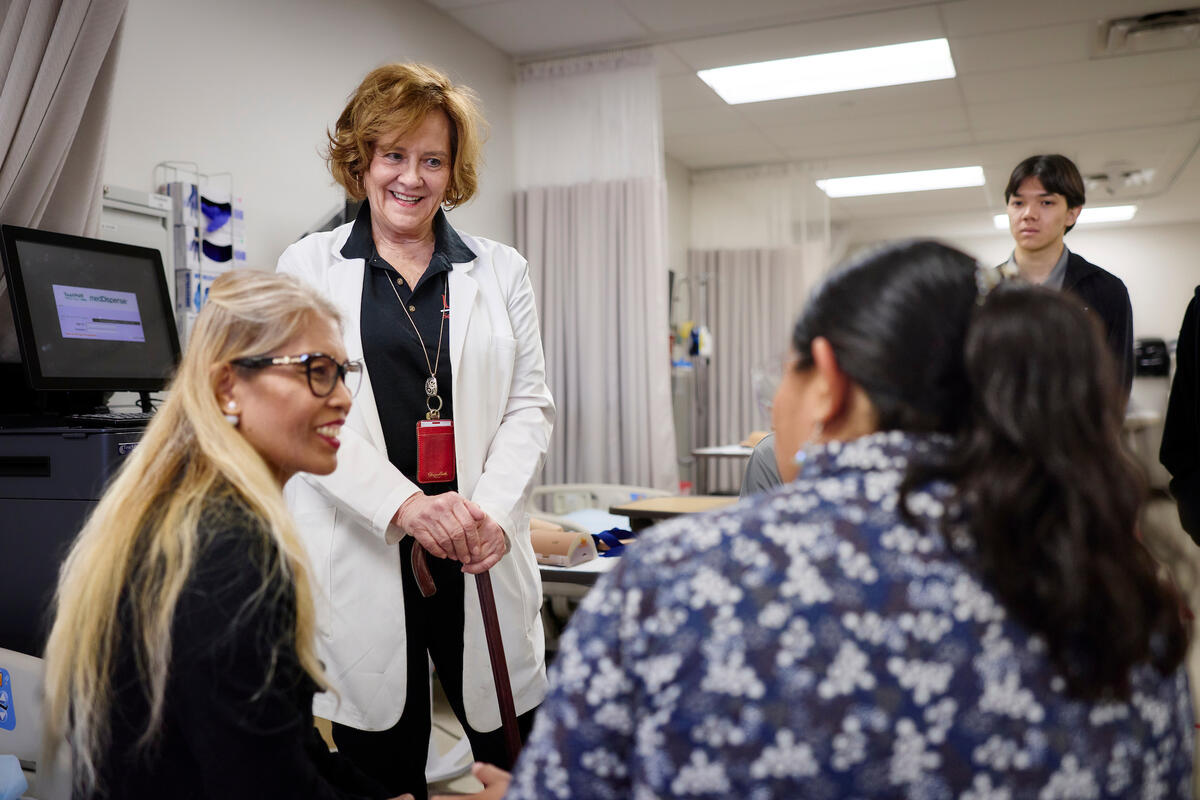 Kathleen Thimsen speaking with students