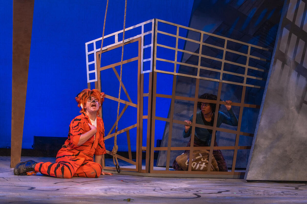 two actors in costume on a stage