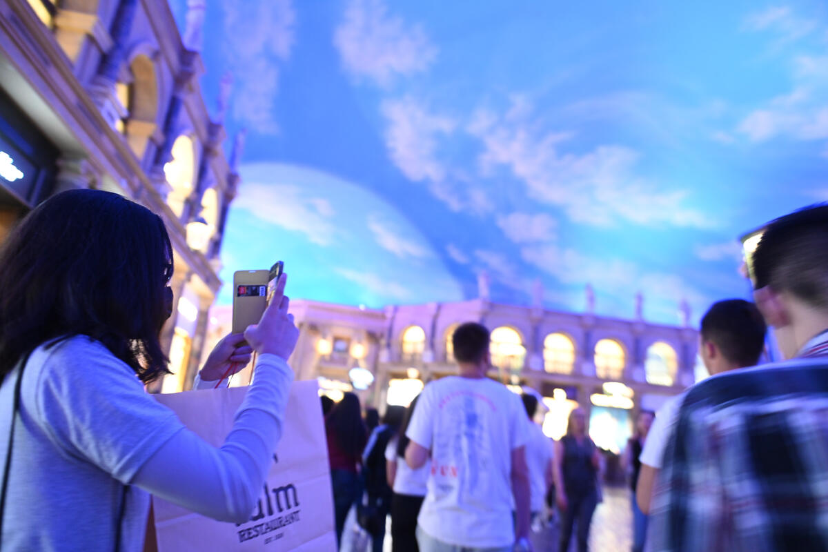 Students taking a picture of the ceiling at the Venitian