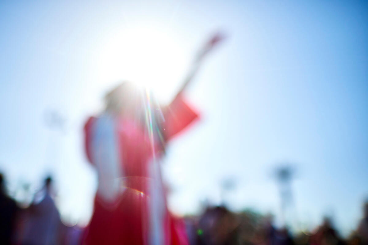 blurred figure in UNLV commencement robe