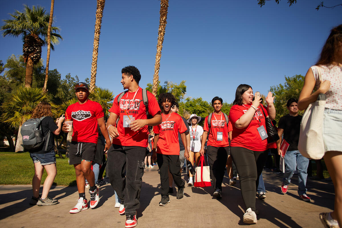 A crowd of students and their family members walking together during Family Send Off