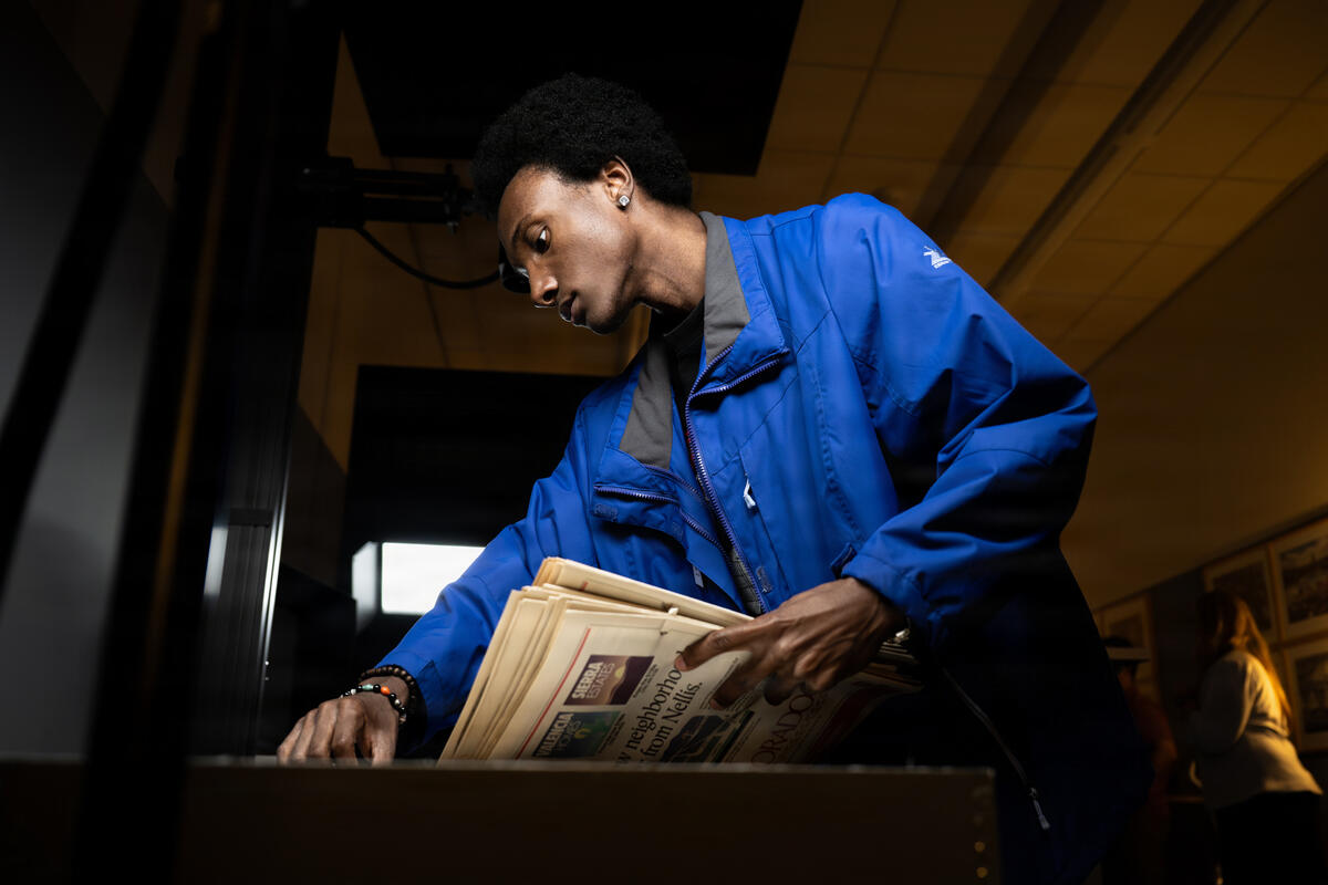 UNLV student working on newspaper archives
