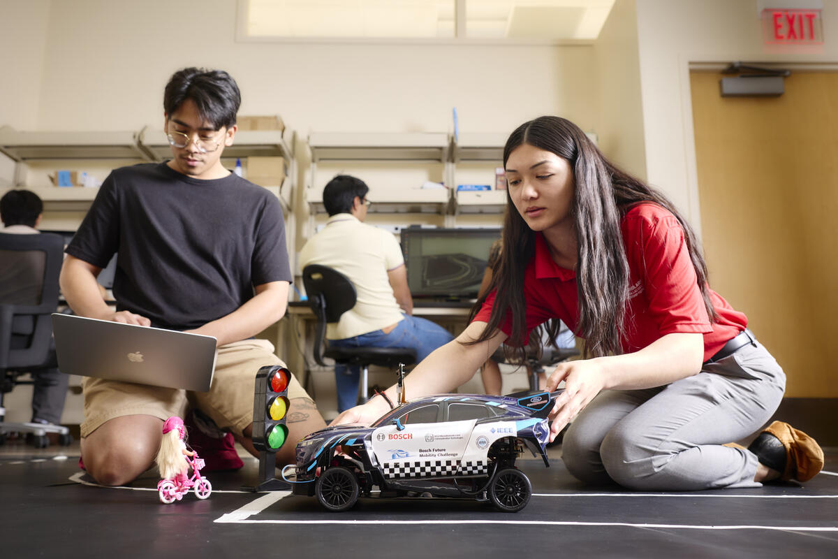 Photo of students working on an RC car