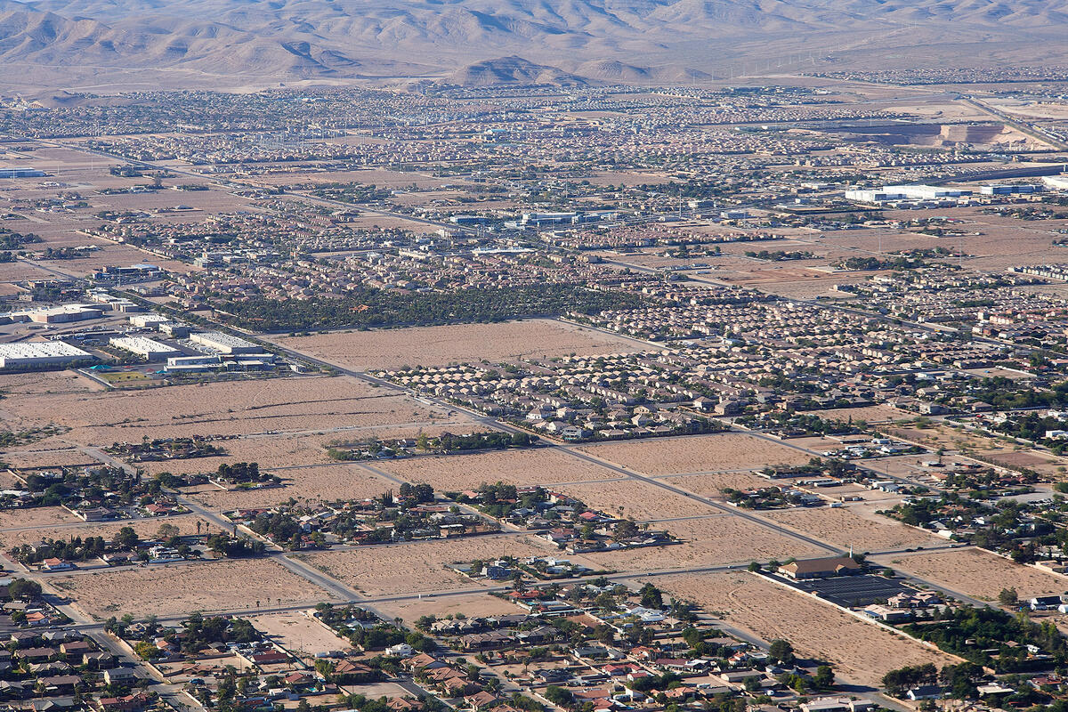 An aerial view of residential neighborhoods in a desert landscape