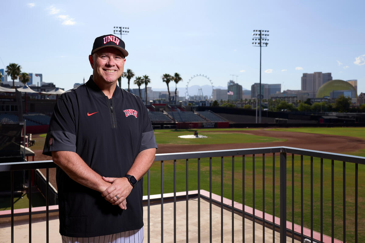 Baseball Coach Nick Garritano in front of field with Vegas Strip in background