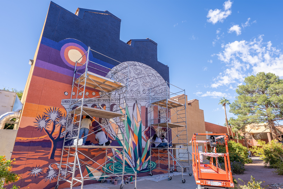 A mural being painted on a wall
