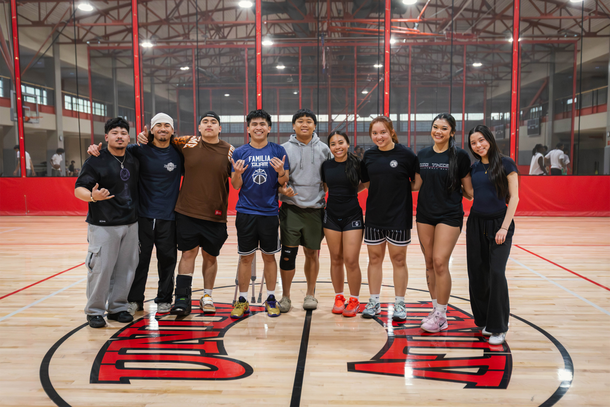 Students posing a gymnasium
