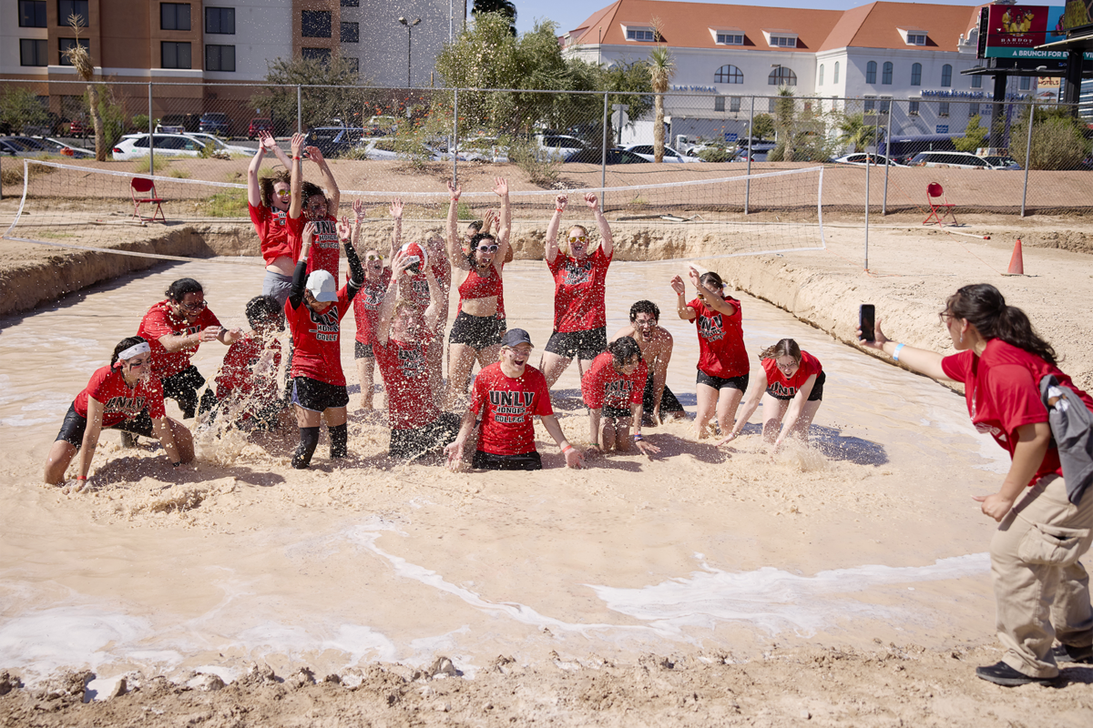 Students celebrating in the center of an oozeball court