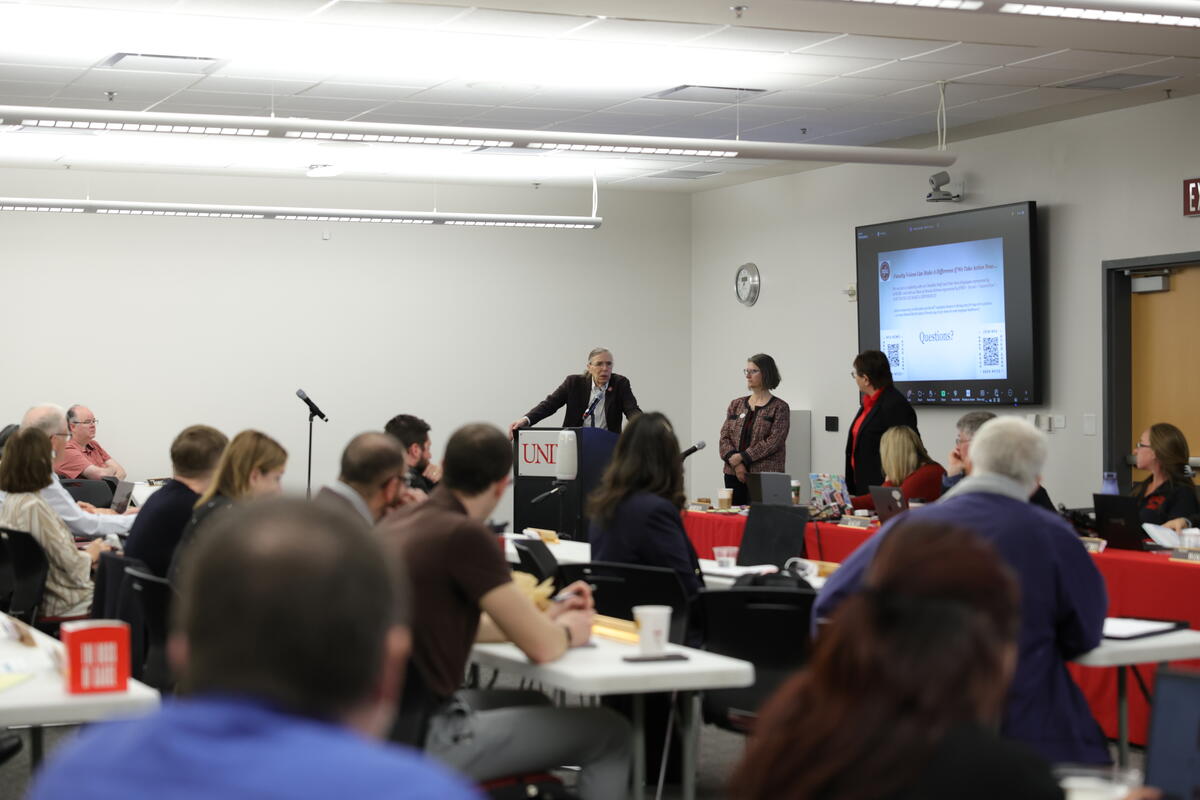 A group of people in a meeting room
