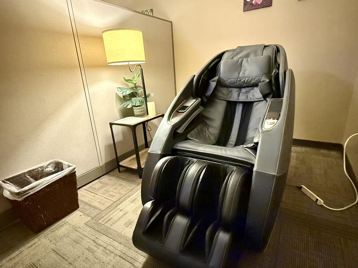 A clean massage chair in a small room