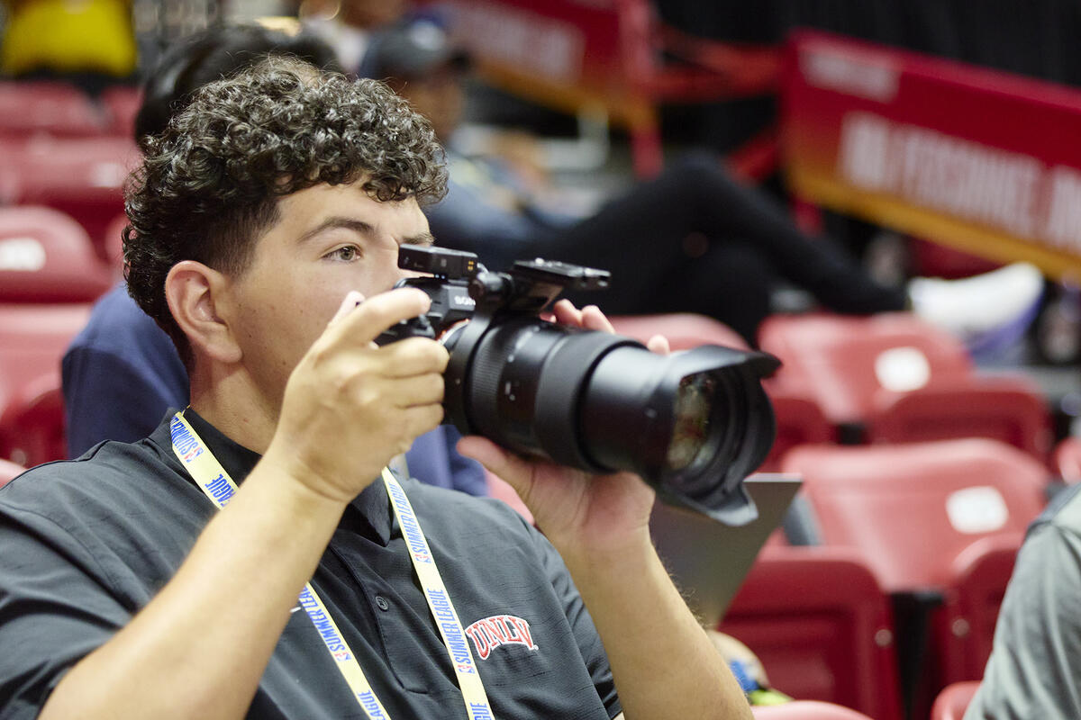 Young man holding a camera