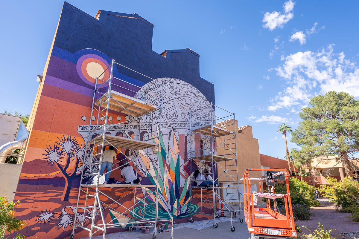 A mural being painted on a wall