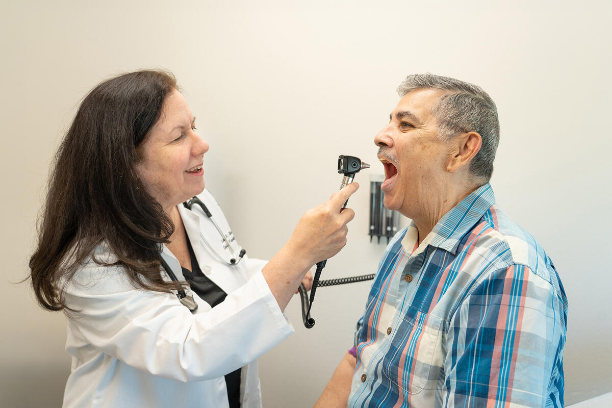Dr. Laura Shaw treating a patient inside an exam room