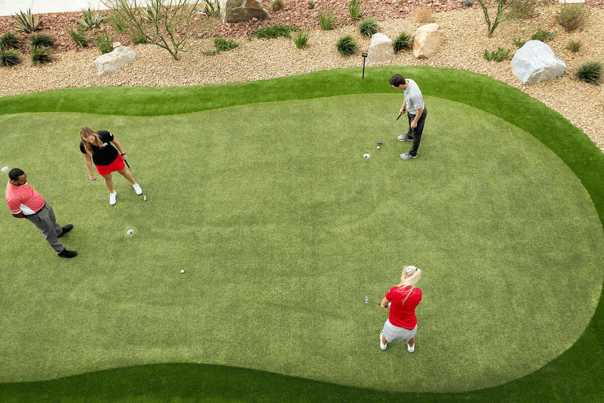 Four people on a golf course