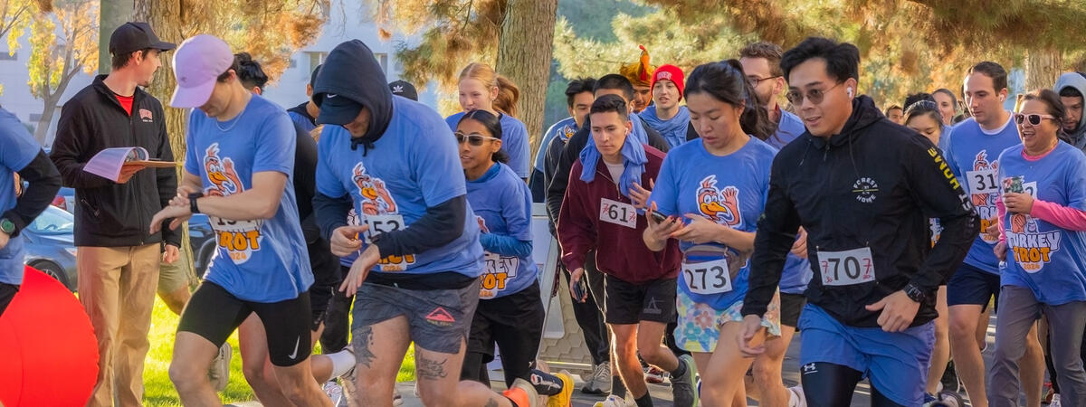 A group of runners in turkey trot shirts