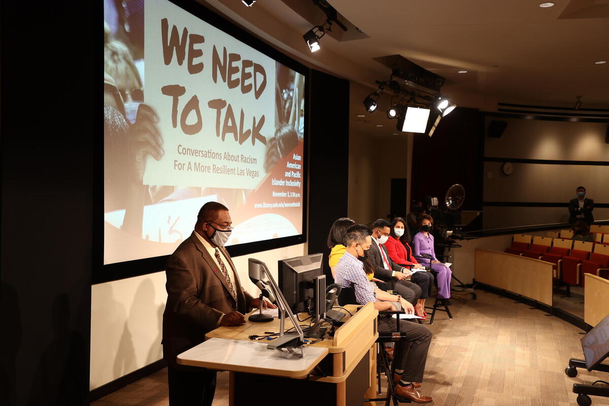 Man at podium in auditorium