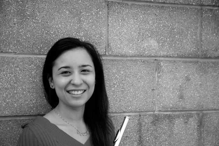 black and white photo of a woman with flute