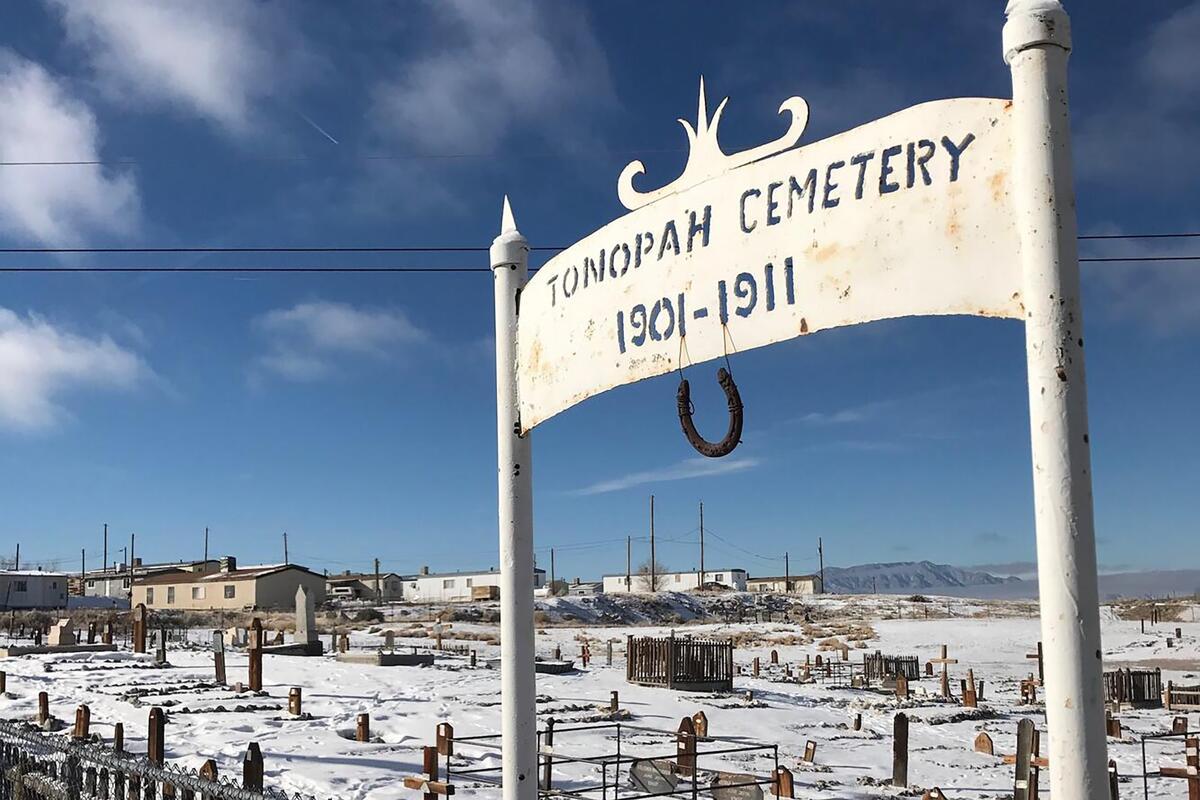 Cemetary with sign that reads "Tonopah Cememtary 1901-1911."