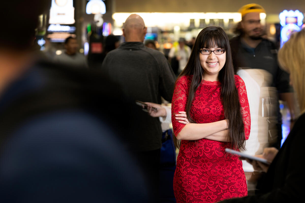 Photo of Martha Amaya standing in a crowded group of people.