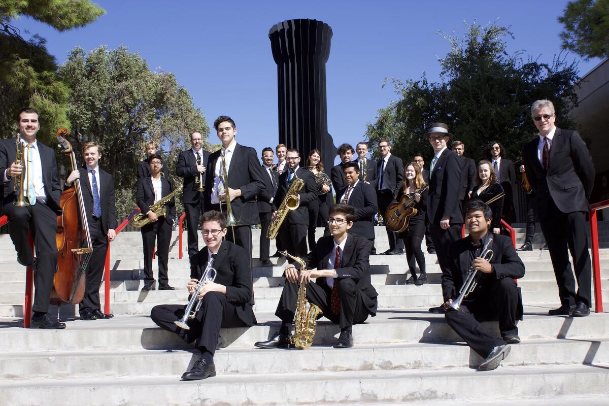 musicians posing with instruments outdoors