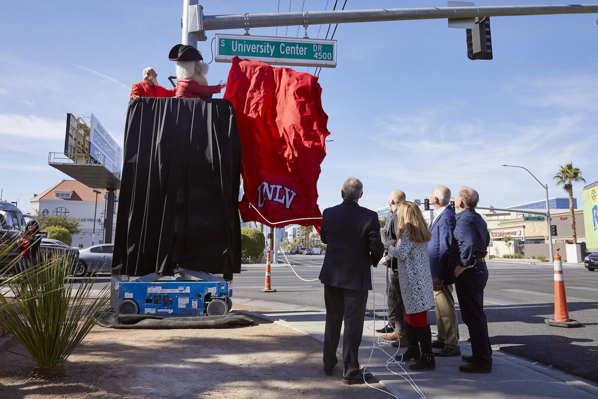 A U.N.L.V.-branded banner falls to reveal University Center Drive, formerly Swenson Street.