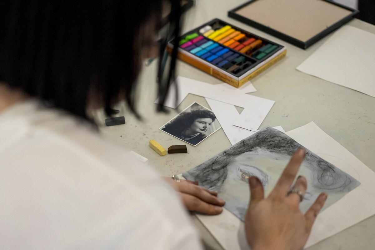 woman drawing with a portrait