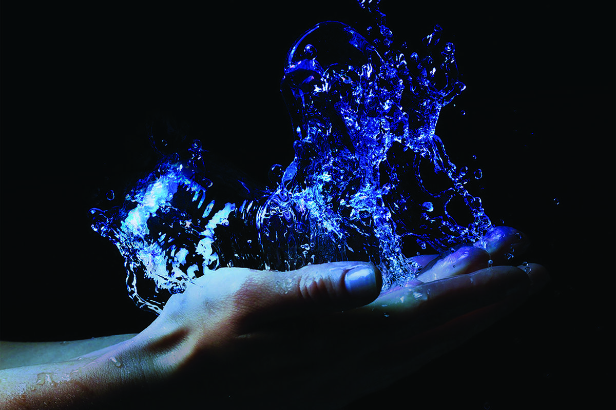 water splahes on an open hand