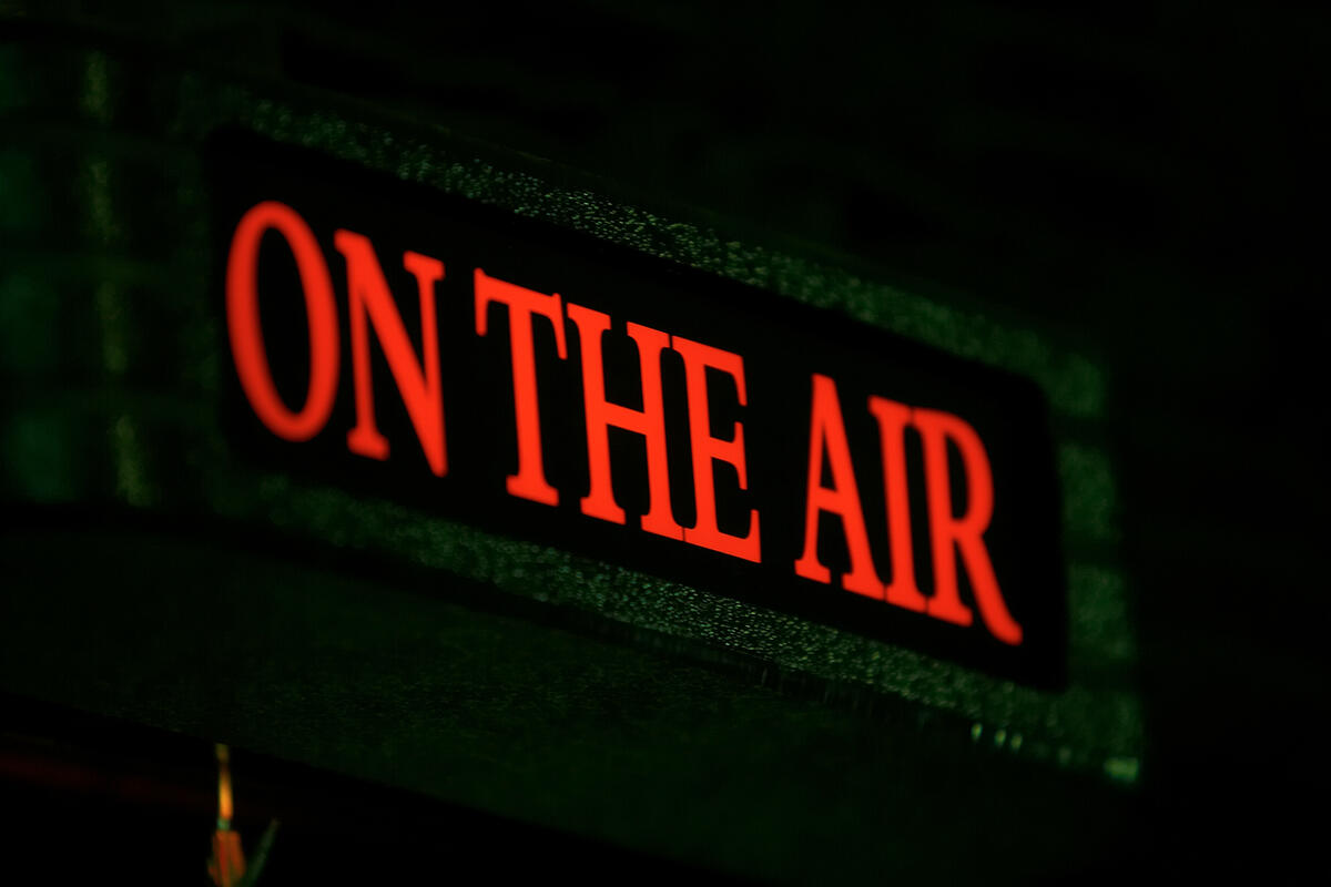 Lighted sign that says On the Air