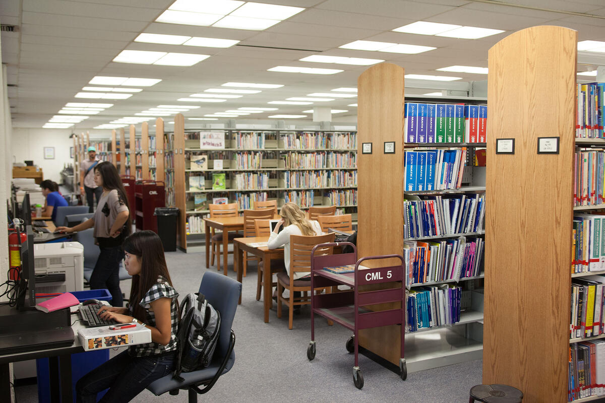 Students access computer kiosks at the Teacher Development Resources Library.