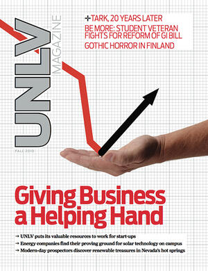 Magazine cover featuring a hand holding a graphic of an arrow