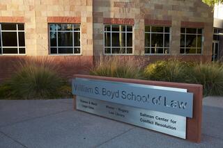 A sign for the William S. Boyd School of Law in front of the building.
