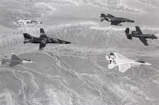 A Nellis Air Force Base archival photo of five aircrafts.