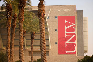 Lied Library with a giant red UNLV banner.