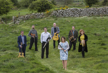 Irish Ensemble Danú outside on green hill
