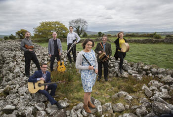 Irish Ensemble Danú outside on green hill