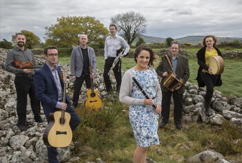 Irish Ensemble Danú outside on green hill