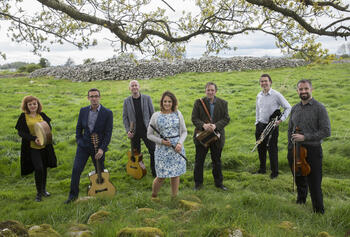 Irish Ensemble Danú outside on green hill