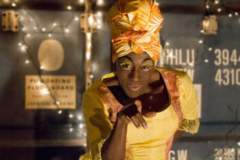 Ghost of Christmas Present pointing towards camera.