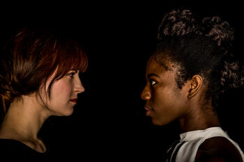 two actresses facing each other