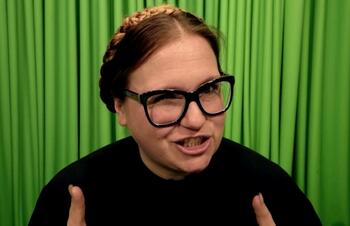 woman in front of green background