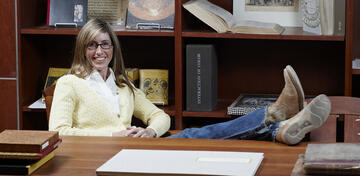 Leisl Carr Childers sits at desk