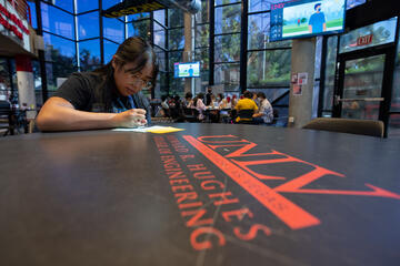woman writing a note