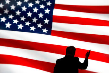 American flag with a shadow of a person