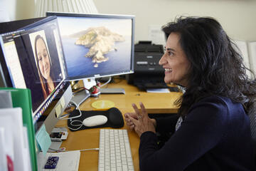 two women talking via video conference call