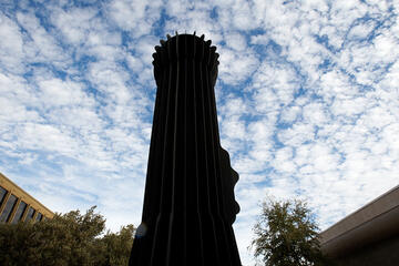 Low point of view of the campus sculpture called the "Flashlight"