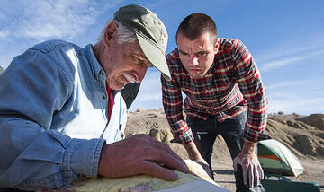 Professor Stephen Rowland goes over a map with undergraduate student Andrew Rigney.