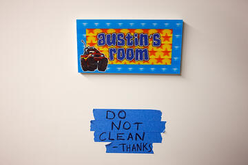 MFA student Abraham Abebe, right, explains his work to undergraduate art student Gabby Aguilar.