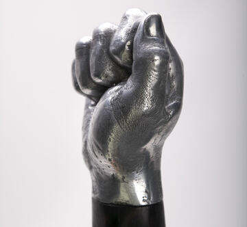 Close up view of the end of a mace. It's a cast from the hand of one of the artists.
