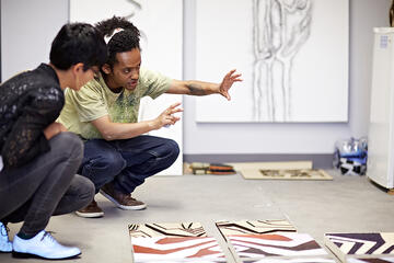 Art students working inside of the studio.